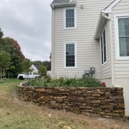 Retaining Wall Foundation — Masonry retaining wall at residential foundation.