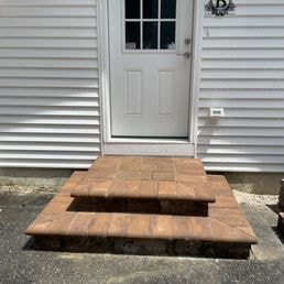 Wooden Steps & Entry — Wooden steps leading to white door entry.