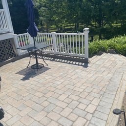 Patio with White Railing — Patio with white railing and outdoor seating.