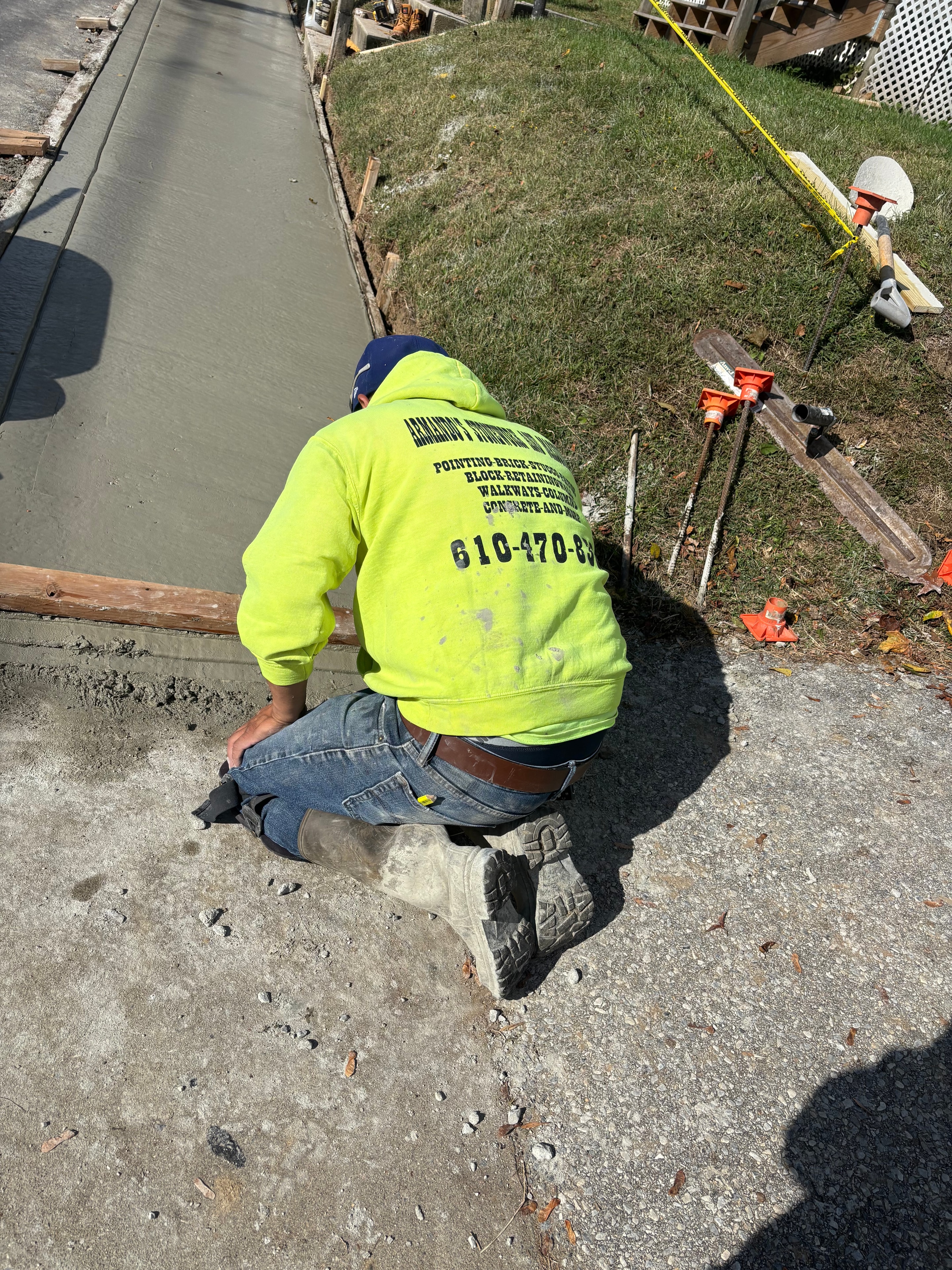 Concrete Finishing Work — Armando's crew finishing fresh concrete on a residential project.
